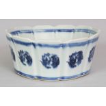 A CHINESE MING STYLE BLUE & WHITE PORCELAIN BOWL, with fluted sides, the interior decorated with