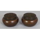 A PAIR OF MINIATURE BRONZE CENSERS & COVERS, weighing 285gm in total, each cover of pierced floral