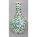 A CHINESE DOUCAI PORCELAIN BOTTLE VASE, decorated with two dragons amidst formal scrolling