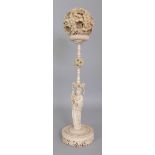 A GOOD LARGE EARLY 20TH CENTURY CHINESE CARVED CONCENTRIC CANTON IVORY BALL ON STAND, the outer