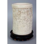 A GOOD LARGE 19TH CENTURY CHINESE CANTON IVORY BRUSHPOT, together with a fixed wood stand, the sides