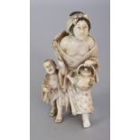 A GOOD QUALITY JAPANESE MEIJI PERIOD IVORY OKIMONO OF A MOTHER & TWO CHILDREN, the woman bearing a