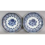 A PAIR OF EARLY 18TH CENTURY CHINESE BLUE & WHITE PORCELAIN DISHES, of shaped octagonal form with