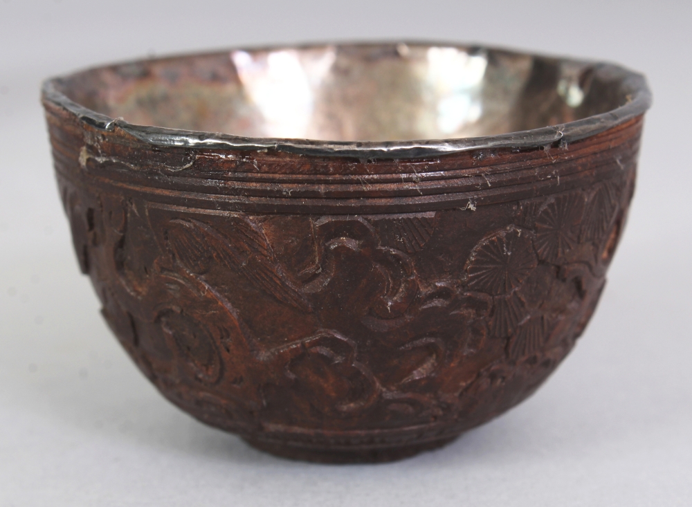 A GROUP OF FIVE 19TH CENTURY CHINESE COCONUT CUPS, with fitted silver liners some bearing an - Image 5 of 10