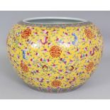 A LARGE CHINESE YELLOW GROUND FAMILLE ROSE PORCELAIN JARDINIERE, the sides decorated with an overall