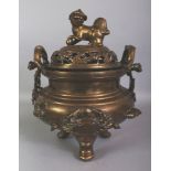 A LARGE EARLY 20TH CENTURY CHINESE POLISHED BRONZE TRIPOD CENSER & COVER, the sides unusually cast