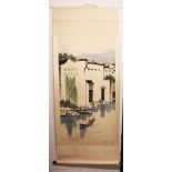 A CHINESE HANGING SCROLL PICTURE, depicting a riverside town scene, the picture itself approx.
