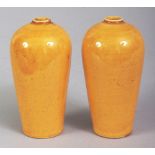 A SMALL PAIR OF ORIENTAL YELLOW GLAZED PORCELAIN VASES, of near meiping form, 3.5in high.