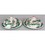 A PAIR OF GOOD QUALITY 19TH CENTURY CHINESE FAMILLE VERTE PORCELAIN VASE COVERS, each painted with a