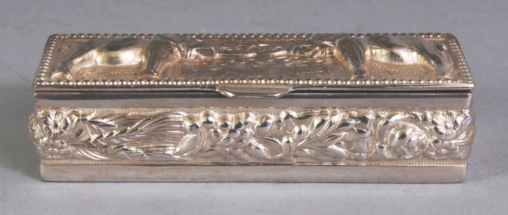 A SOUTH-EAST ASIAN SILVER-METAL RECTANGULAR PILL BOX, weighing approx. 29gm, the cover embossed with