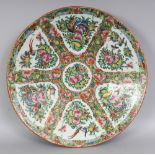A LARGE 19TH/20TH CENTURY CHINESE CANTON PORCELAIN CHARGER, with flaring sides, the interior painted
