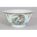 A CHINESE DOUCAI PORCELAIN BOWL, the sides decorated with repeated roundels of ducks in a lotus