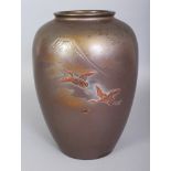 A SIGNED EARLY 20TH CENTURY JAPANESE MIXED METAL VASE, decorated with a scene of two storks in