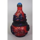 A CHINESE RED GROUND BLUE OVERLAY DOUBLE GOURD GLASS SNUFF BOTTLE & STOPPER, decorated with