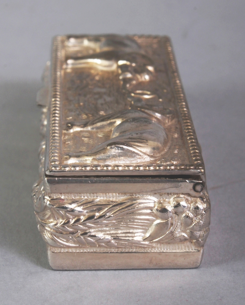 A SOUTH-EAST ASIAN SILVER-METAL RECTANGULAR PILL BOX, weighing approx. 29gm, the cover embossed with - Image 4 of 8