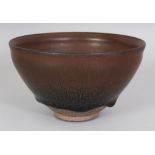 A CHINESE SONG STYLE JIAN WARE HARE'S FUR CERAMIC BOWL, applied with a streaked glaze falling