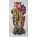 AN EARLY/MID 20TH CENTURY CHINESE SOAPSTONE VASE, of green-amber tone together with a fixed black