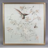 A 20TH CENTURY FRAMED CHINESE EMBROIDERED SILK PANEL, decorated with a bird in flight above