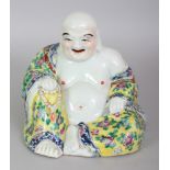 AN EARLY 20TH CENTURY CHINESE FAMILLE ROSE PORCELAIN FIGURE OF BUDAI, seated with exposed belly
