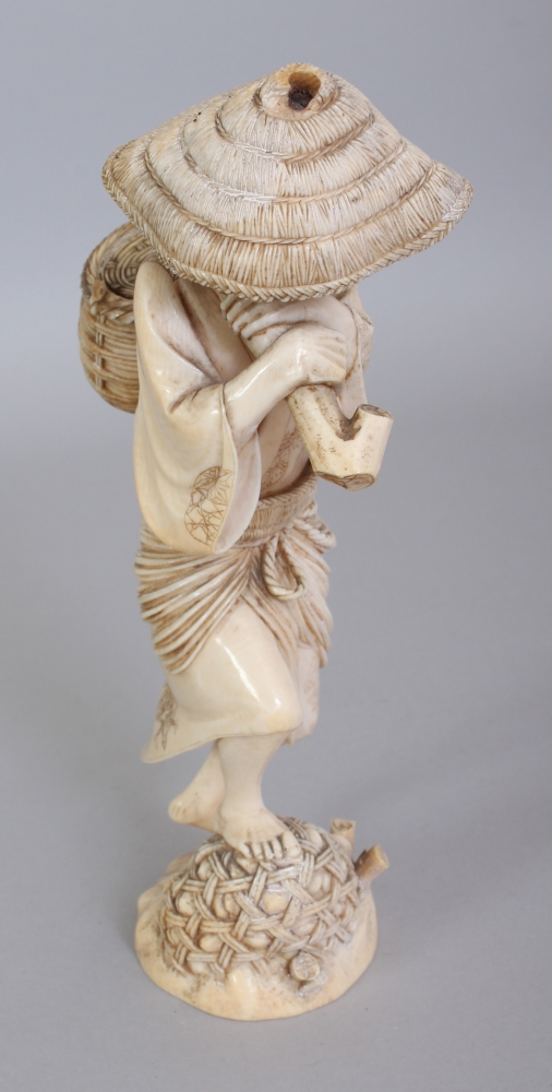 A GOOD QUALITY SIGNED JAPANESE MEIJI PERIOD IVORY OKIMONO OF AN ARTISAN, standing on rockwork and - Image 2 of 8