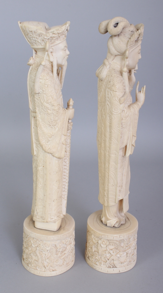 A GOOD PAIR OF EARLY 20TH CENTURY CHINESE IVORY FIGURES OF AN EMPEROR & AN EMPRESS, each standing on - Image 2 of 8