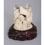 A FINE QUALITY JAPANESE MEIJI PERIOD IVORY OKIMONO OF TWO LADIES & TWO BOYS, together with a