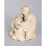 A SMALL FINE QUALITY JAPANESE MEIJI PERIOD IVORY OKIMONO, carved in the form of two ladies, one
