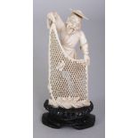 AN EARLY 20TH CENTURY CHINESE IVORY FIGURE OF A FISHERMAN, together with a fixed wood stand, the man