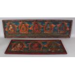 TWO 20TH CENTURY TIBETAN PAINTED RECTANGULAR WOOD PANELS, depicting Buddhas and Bodhisattvas, 40in x