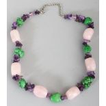 A HARDSTONE NECKLACE, composed of irregularly shaped rose quartz, amethyst and green hardstone