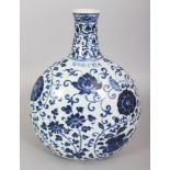 A CHINESE MING STYLE BLUE & WHITE PORCELAIN MOON FLASK, the sides decorated with scrolling