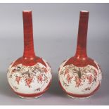 A PAIR OF EARLY 20TH CENTURY JAPANESE KUTANI PORCELAIN BOTTLE VASES, each base with a Kutani mark,