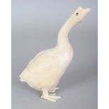 A FINE QUALITY JAPANESE MEIJI PERIOD IVORY OKIMONO OF A GOOSE, with mother-of-pearl inlaid eyes, its