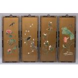 A SET OF FOUR CHINESE ONLAID GILT GROUND WALL PANELS, in lacquered wood frames, each decorated