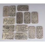 A GROUP OF THIRTEEN CHINESE RECTANGULAR SILVER-METAL TABLETS, with indented corners, weighing