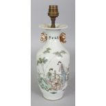 A 20TH CENTURY CHINESE FAMILLE ROSE PORCELAIN VASE, fitted for electricity, the sides painted with