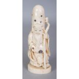 A GOOD SIGNED JAPANESE MEIJI PERIOD SHIBAYAMA & IVORY OKIMONO OF FUKUROKUJU, standing and holding