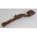 A CHINESE WOOD RUYI SCEPTRE, decorated in high relief with lingzhi and bats, 13.4in long.