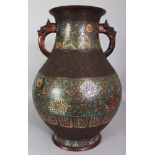 A LARGE EARLY 20TH CENTURY JAPANESE CHAMPLEVE & BRONZE VASE, the sides with formal bands of