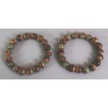 A PAIR OF CHINESE JADE-LIKE HARDSTONE BRACELETS, composed of spherical beads.