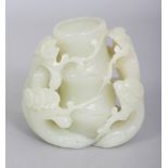 A CHINESE CELADON JADE-LIKE MODEL OF BAMBOO & PLUM BLOSSOM, 2.75in wide & 2.8in high.