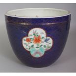 AN EARLY/MID 20TH CENTURY JAPANESE FUKAGAWA PORCELAIN JARDINIERE, painted with floral panels