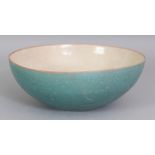 AN UNUSUAL CHINESE CRACKLEGLAZE PORCELAIN BOWL, the sides applied with a turquoise-green glaze,
