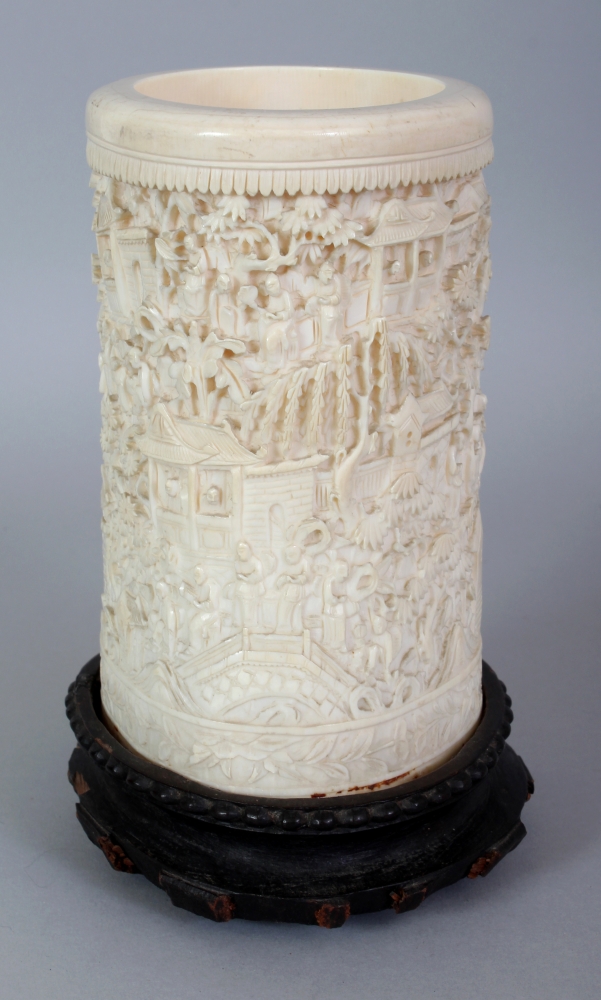 A GOOD LARGE 19TH CENTURY CHINESE CANTON IVORY BRUSHPOT, together with a fixed wood stand, the sides - Image 2 of 7