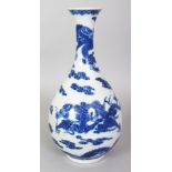 A CHINESE BLUE & WHITE PORCELAIN DRAGON BOTTLE VASE, decorated with dragons amidst flame and cloud