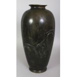 A SIGNED JAPANESE MEIJI/TAISHO PERIOD GREEN PATINATED BRONZE VASE, the sides cast in relief with a