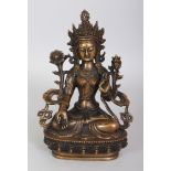 A TIBETAN BRONZE FIGURE OF A FEMALE BODHISATTVA, seated in dhyanasana on a lotus plinth, 5.9in