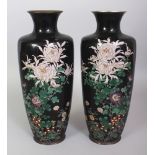 A PAIR OF GOOD QUALITY JAPANESE MEIJI PERIOD BLACK GROUND CLOISONNE VASES, each decorated with a