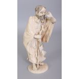 A SIGNED JAPANESE MEIJI PERIOD SECTIONAL IVORY OKIMONO OF A STANDING FISHERMAN, gazing into the