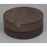 A JAPANESE CIRCULAR WOOD BOX & COVER, the cover decorated in relief with storks and pine, 4.25in